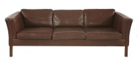 Lot 570 - A Danish brown leather three-seater settee