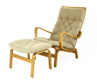 Lot 372 - A beechwood chair and ottoman