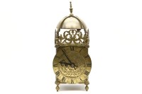 Lot 235A - A brass cased lantern clock with foliate pierced frieze band