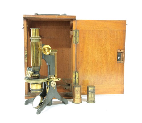 Lot 188 - A mahogany and brass microscope