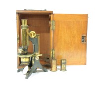 Lot 188 - A mahogany and brass microscope