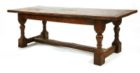 Lot 558 - An oak refectory table