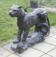 Lot 595 - A contemporary bronze sculpture of a leopard