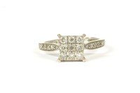 Lot 55 - A 9ct white gold nine stone diamond square cluster ring