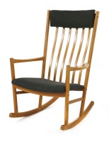 Lot 378 - A teak rocking chair