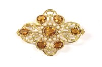 Lot 71 - A gold citrine and split pearl open framed brooch