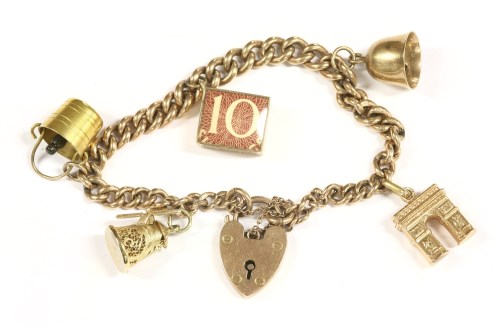 Lot 75 - A 9ct gold curb link charm bracelet