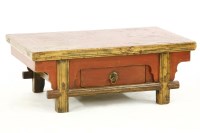 Lot 376 - A Chinese red painted low single drawer scholar’s table