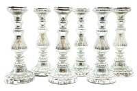Lot 232 - A set of six silvered glass candle stands