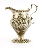 Lot 128 - A George III silver cream jug