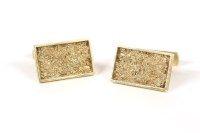 Lot 33 - A pair of 9ct gold rectangular textured swivel cufflinks