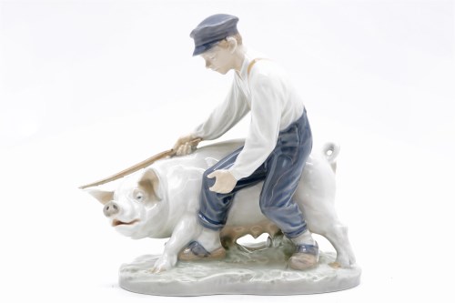 Lot 147 - A Royal Copenhagen figure of a farmer and pig