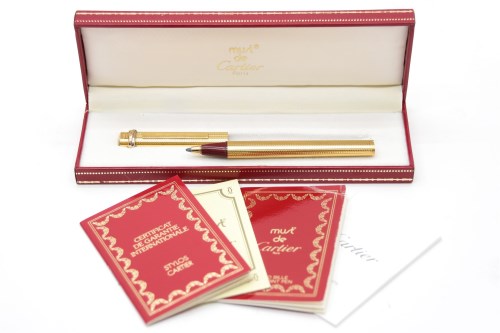 Lot 104 - A Les Must De Cartier gold plated ballpoint pen