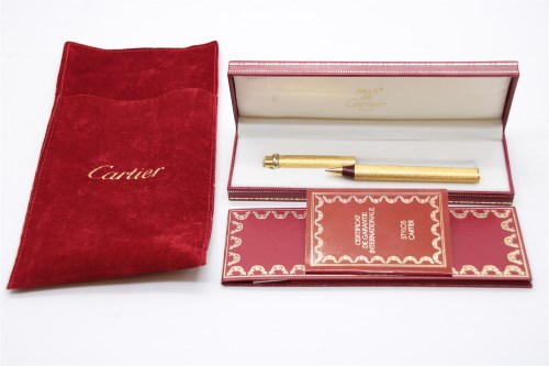 Lot 106 - A Les Must De Cartier gold plated ballpoint pen