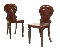 Lot 540 - A pair of mahogany hall chairs