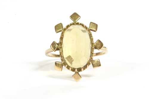 Lot 82 - A 9ct gold single stone oval cheque cut citrine ring