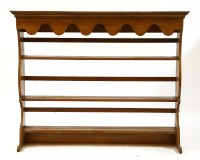 Lot 383 - A 19th century English cherry wood plate rack