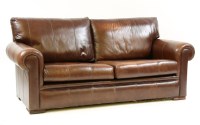 Lot 575 - A modern brown leather settee