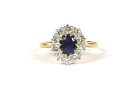 Lot 5 - A sapphire and diamond oval cluster ring
