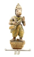 Lot 318 - A carved and painted wooden figure of an Indian deity with horse's head and holding an instrument