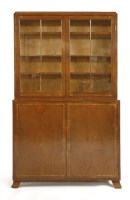 Lot 163 - An Heal's walnut and crossbanded bookcase cabinet