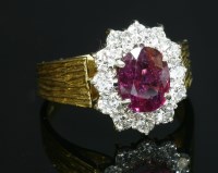 Lot 379 - An 18ct gold, ruby and diamond cluster ring, c.1975