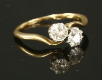 Lot 404 - A two stone diamond crossover ring