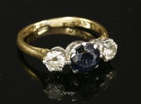 Lot 77 - A three stone sapphire and diamond ring