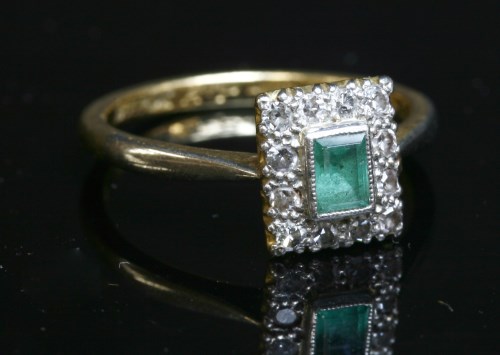 Lot 355 - An emerald and diamond rectangular cluster ring
