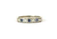 Lot 12 - A white gold seven stone diamond and sapphire ring