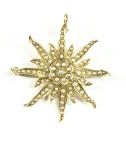 Lot 14 - A split pearl starburst brooch