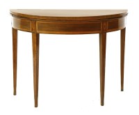 Lot 446 - An Edwardian Sheraton style mahogany demi-lune fold over table