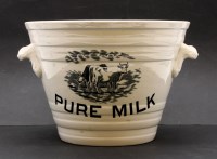 Lot 193 - A white glazed pottery milk pail