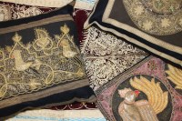 Lot 244 - A collection of Indian wall hangings and a cushion