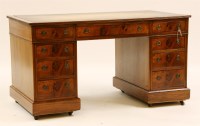 Lot 568 - A late Victorian walnut nine drawer twin pedestal desk