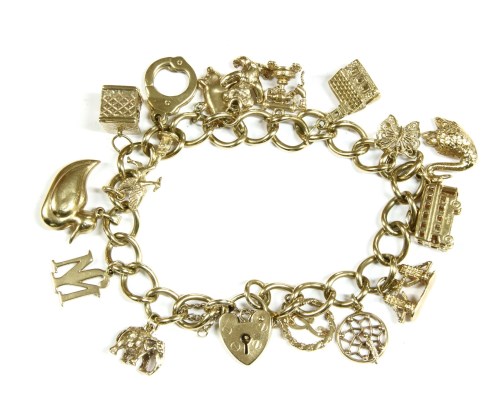 Lot 13 - A 9ct gold curb link charm bracelet