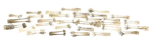 Lot 101 - A collection of various sugar tongs