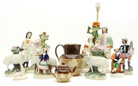 Lot 214 - Staffordshire figures and animals