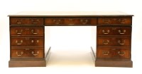 Lot 477 - A reproduction mahogany nine drawer twin pedestal desk