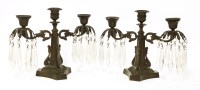 Lot 71 - A pair of bronze three-light candelabra