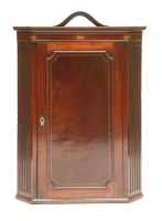Lot 525 - A George III strung mahogany hanging corner cabinet