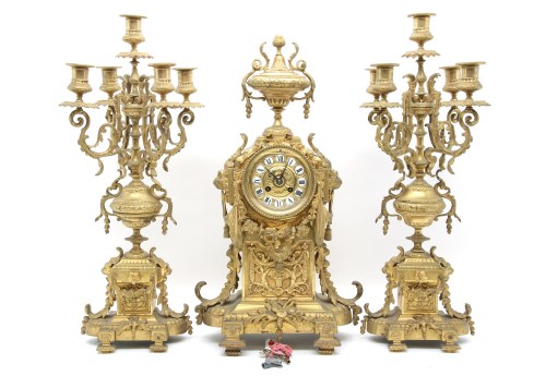 Lot 302 - An early 20th Century gilt metal clock garniture