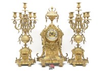 Lot 302A - An early 20th Century gilt metal clock garniture
