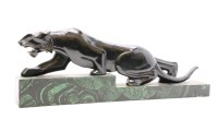 Lot 319 - A hand carved model of a panther on a faux malachite base 

Provenance: From the estate of the late Henry Wilson