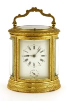 Lot 998 - An oval French brass carriage clock