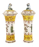 Lot 537 - A pair of Quimper pottery vases and covers