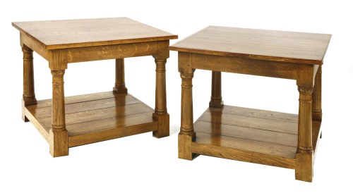 Lot 573 - A pair of solid oak lamp tables