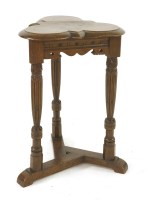 Lot 598 - An oak trefoil table
