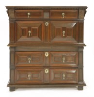Lot 572 - An oak chest of four long drawers