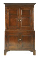 Lot 593 - An oak press cupboard